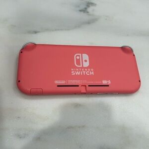 Pink nintendo switch used with no problems comes with charger  and box